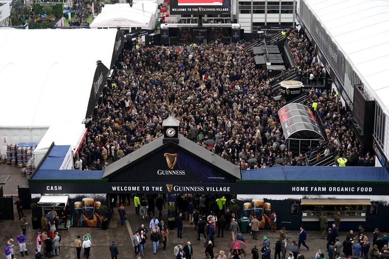 Racegoers at the Guinness Village on day three of the Cheltenham Festival. Photograph: Mike Egerton/PA