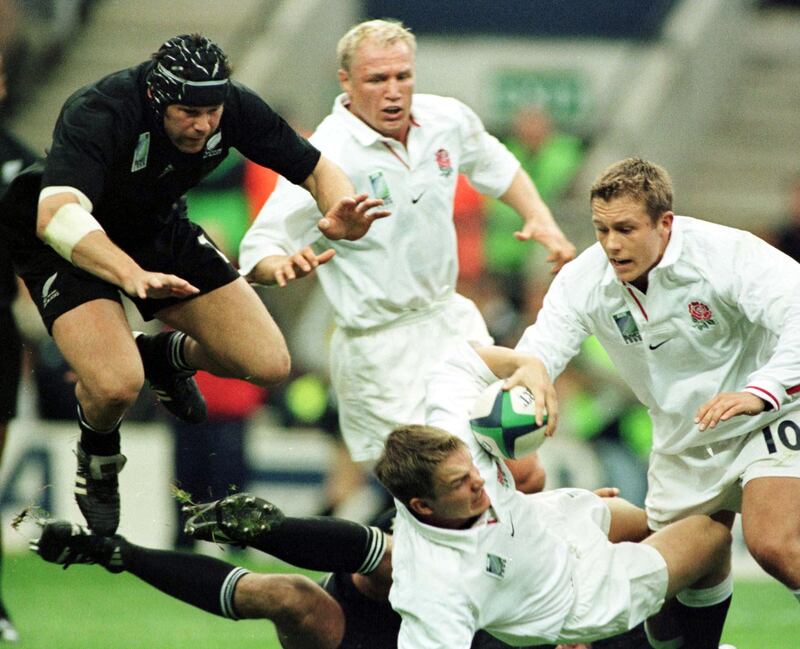 New Zealand flanker Josh Kronfeld hurdles in on England's Matt Perry during the Rugby World Cup pool match at Twickenham in 2009. Photograph: Ross Setford/Getty Images