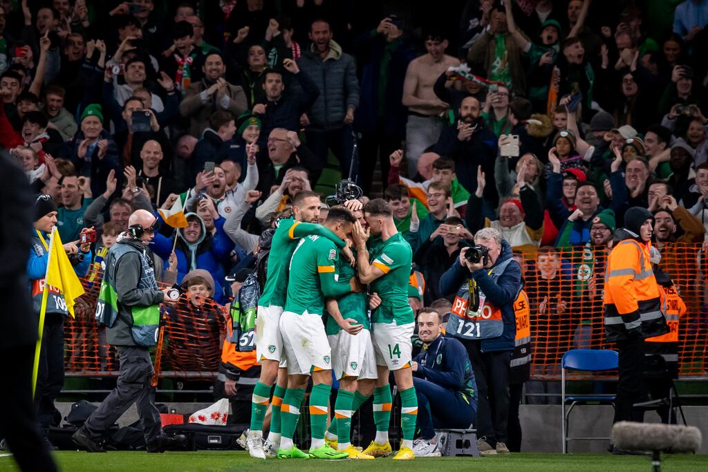 Republic of Ireland players celebrate after Robbie Brady scored from the penalty spot. Photograph: Morgan Treacy/Inpho
