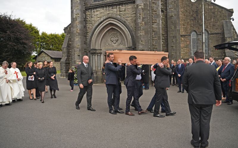 Family members carry the remains of John O’Mahony after his funeral mass. Photograph: Conor McKeown