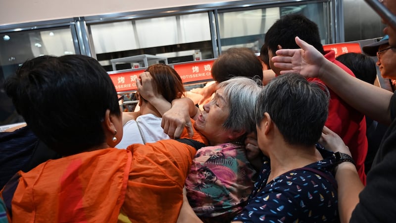 People trying to get a roast chicken at the first Costco outlet in China on Tuesday. Photograph: Getty Images
