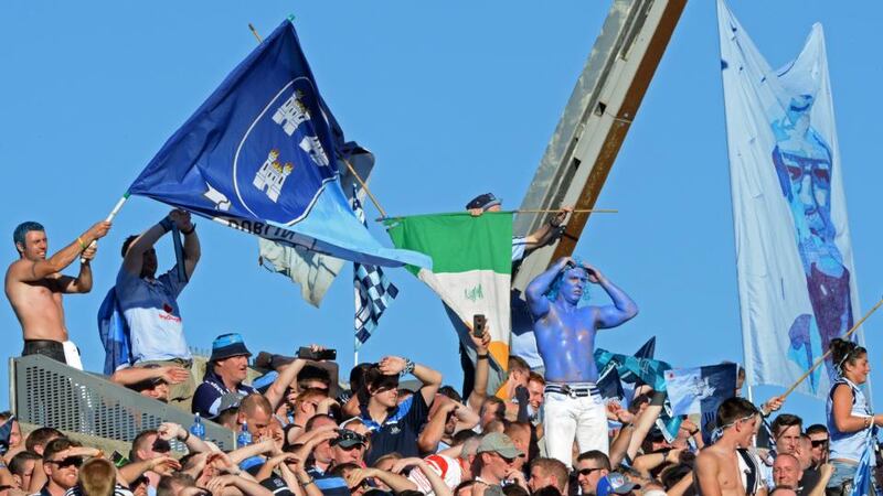 After Dublin’s latest annexing of Sam, Vinny Fitzpatrick and his pals turned to pay their respects to the huge flag of Kevin Heffernan held aloft on Hill 16. Photograph: Eric Luke /The Irish Times