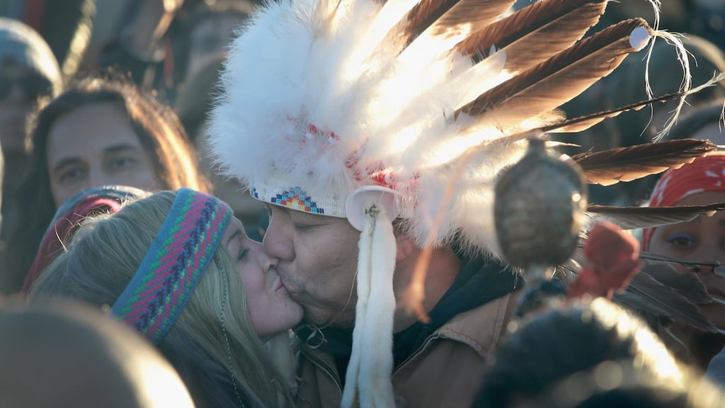 Native American and other activists celebrate after learning an easement had been denied for the Dakota Access Pipeline at Oceti Sakowin Camp on the edge of the Standing Rock Sioux reservation on Sunday outside Cannon Ball, North Dakota. Photograph: Scott Olson/Getty Images