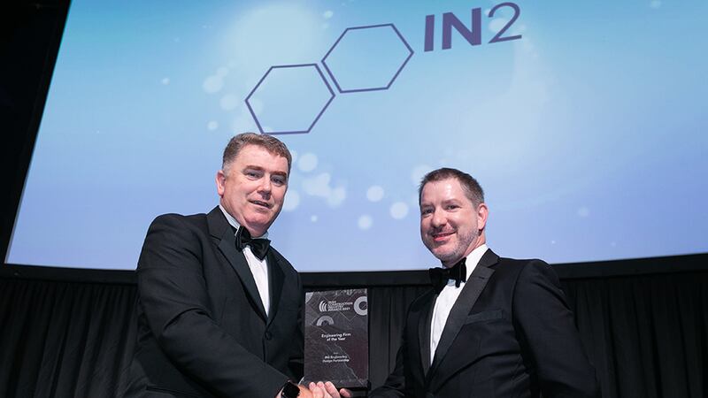 Anthony Greene, Awards Judge, presents Engineering Firm of the Year award to Tim Gillen, IN2 Engineering Design Partnership.