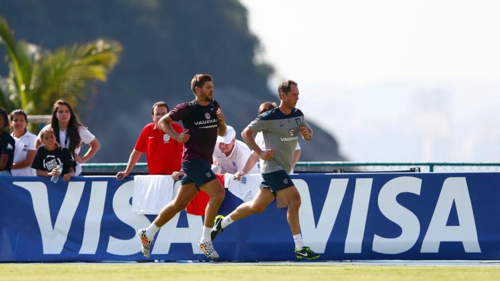 Steven Gerrard trains with a member of the England coaching staff in Rio de Janeiro. Photograph: Eddie Keogh/Reuters