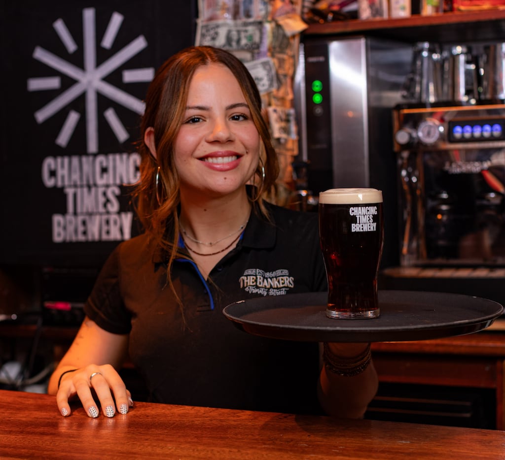 Lorena Sampaio of The Bankers Bar, Trinity Street with a pint of the new Bleedin Red Ale from Changing Times Brewery