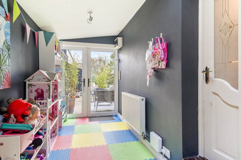 Playroom opening on to back garden