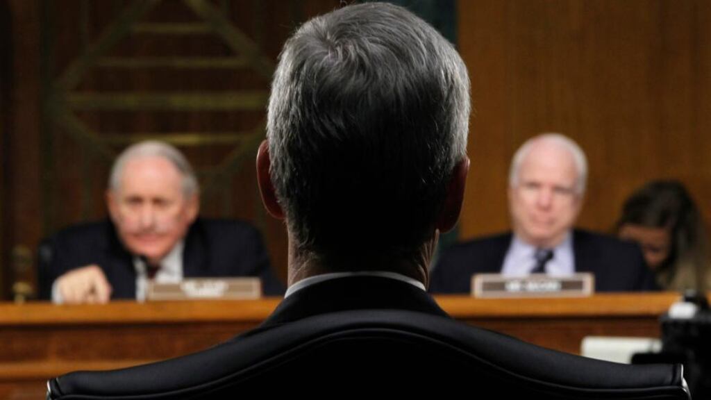 Apple CEO Tim Cook appears before senators Carl Levin and John McCain at committee hearing in Washington. Photograph: Jason Reed /Reuters