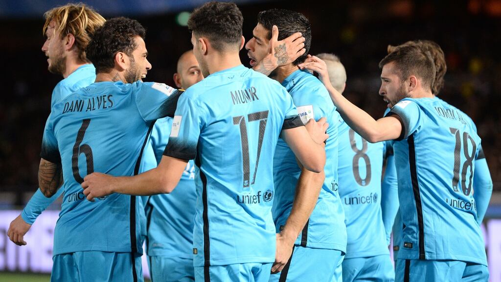 Barcelona celebrate Luis Suarez’s opener in their 3-0 Club World Cup semi-final win over Guangzhou Evergrande. Photograph: Getty
