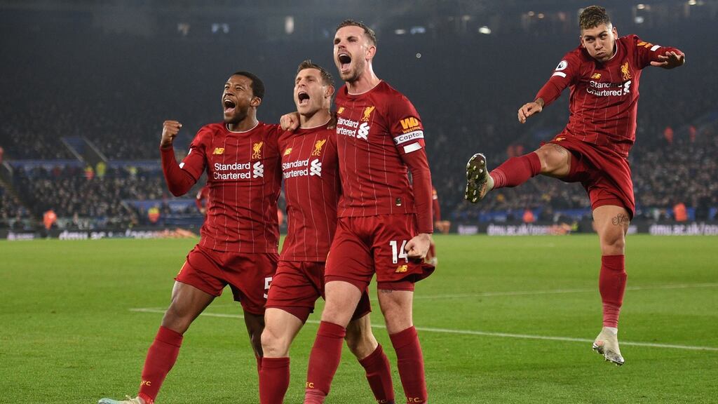 Liverpool players celebrate James Milner’s goal. Photograph: Getty Images
