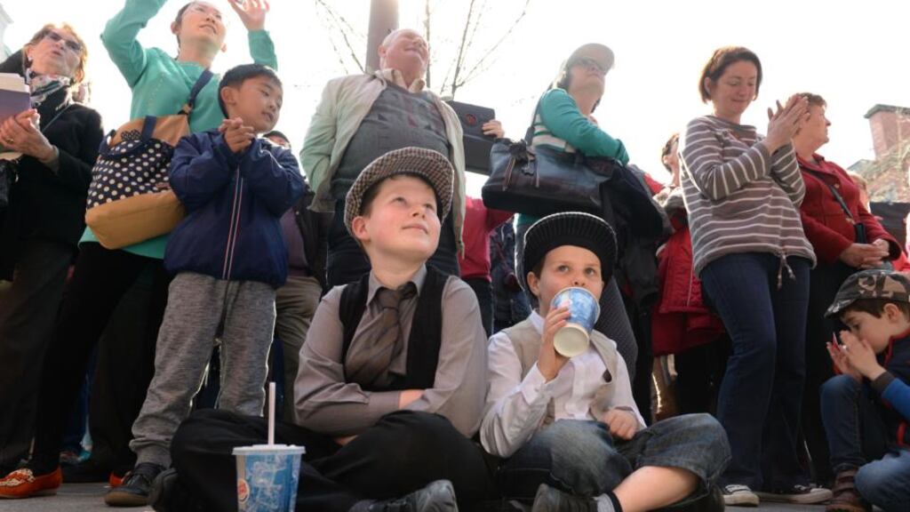 Brothers Ross and Patrick Gaynor, (right) from Terenure, Dublin, enjoy Step into History, part of RTÉ’s Road to the Rising (opposite page, top), on O’Connell Street, Dublin. Photograph: Dara Mac Dónaill
