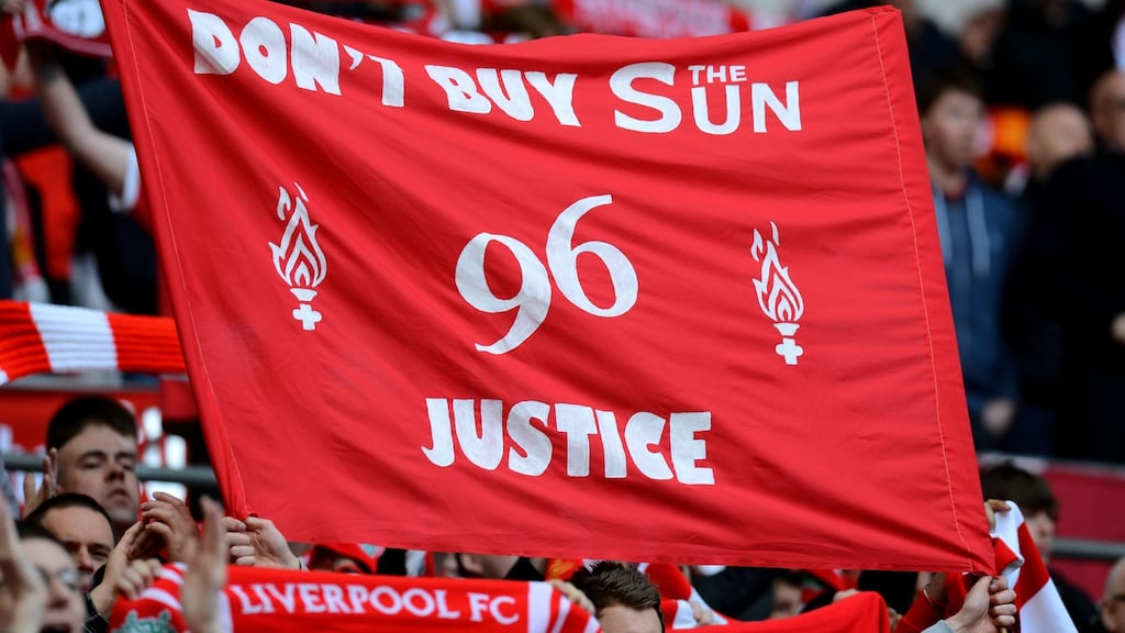 Liverpool fans hold banners in protest against the Sun newspaper prior to the FA Cup semi-final against Everton at Wembley in April 2012. Photograph: Mike Hewitt/Getty Images