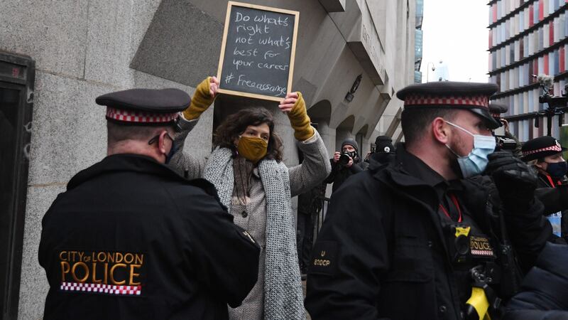 A supporter of Julian Assange outside the Old Bailey. Photograph: Facundo Arrizabalaga