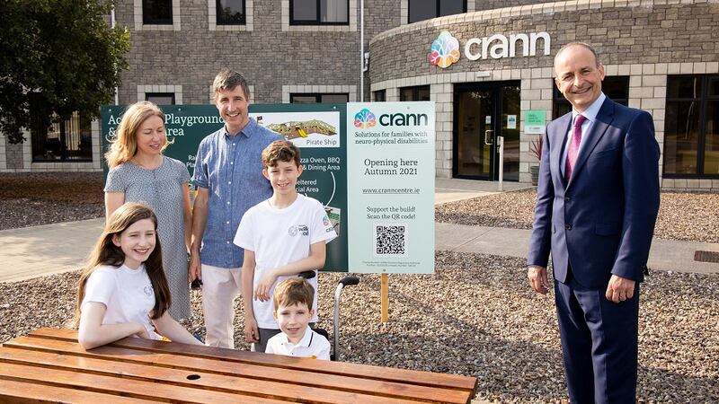 Philip and Maeve Murphy with Felipe (12), Clara (14) and Brendan (6), meeting An Taoiseach Mícheál Martin at the Crann Centre in Ovens, Co Cork.