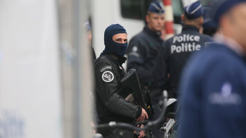 Police officers block the access to City 2 shopping mall during an anti-terrorist operation in Brussels. Photograph: Olivier Hoslet/EPA
