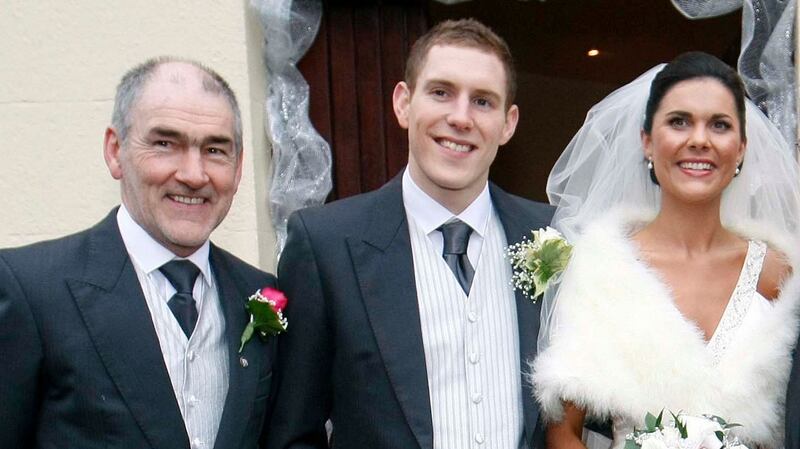 Mickey Harte with daughter Michaela and son-in-law John McAreavey on their wedding day in Ballymacilroy, Co Antrim in January 2011. ‘He was one of our family. He was special in Michaela’s life so he is always going to be special in our lives too.’ Photograph: Irish News