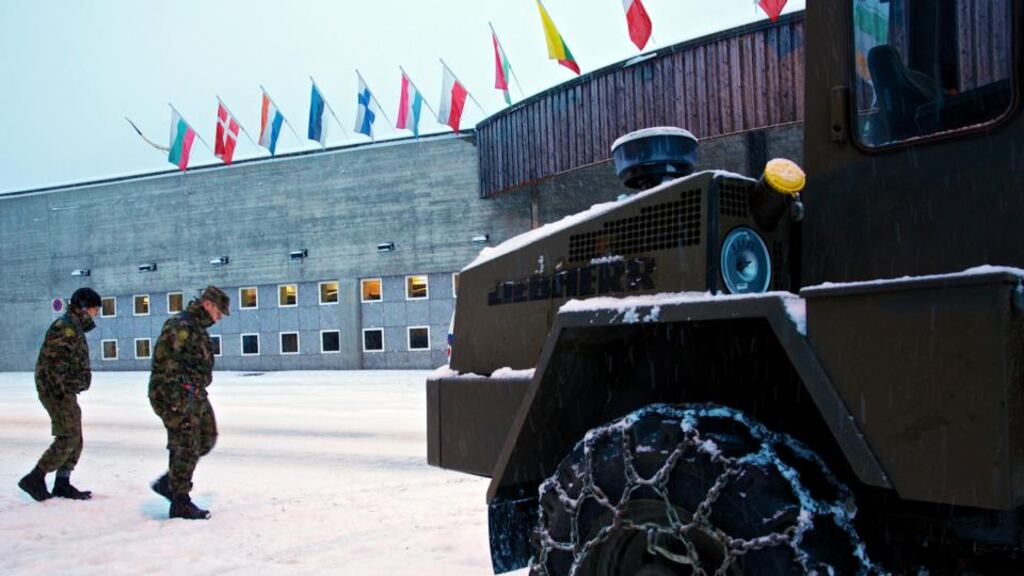 Swiss soldiers outside the Kongress Zentrum, the venue for the World Economic Forum in Davos, Switzerland, this week. photograph: gianluca colla/bloomberg