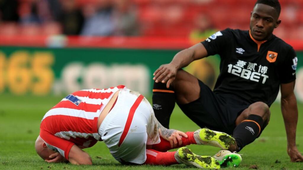 Stoke City’s Stephen Ireland lies on the ground  after the tackle from Hull City’s Maynor Figueroa, which left him needing 12-15 stitches. Photograph: Mike Egerton/PA Wire