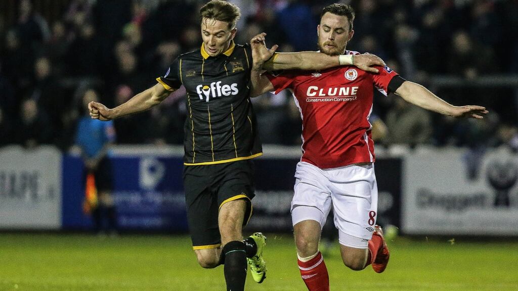 St Patrick’s Atletic Keith Tracey with Ronan Finn of Dundalk. Photograph: Gary Carr/Inpho