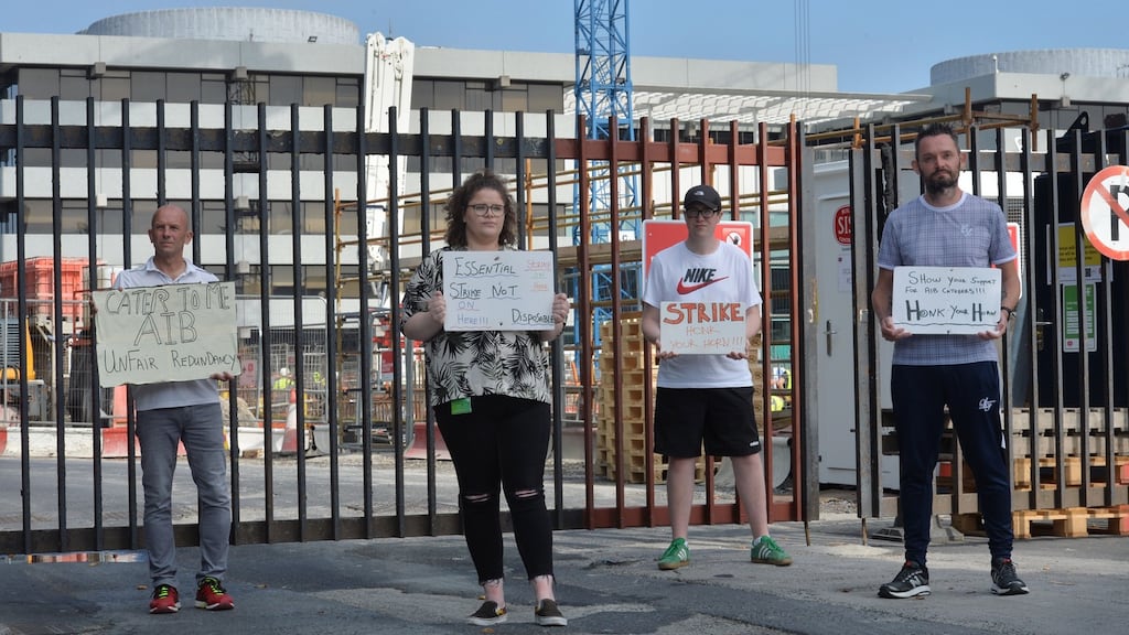 Catering staff Johnny Glynn, Chelsea Connell, Ryan Murphy, and Chris Traynor, laid off employees of Aramark protesting outside their former workplace the former AIB Headquarters in Ballsbridge. Photograph: Alan Betson / The Irish Times