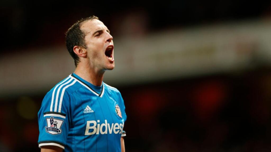 John O’Shea celebrates after Sunderland’s 0-0 draw away at Arsenal secured their Premier League survival. Photograph: Reuters
