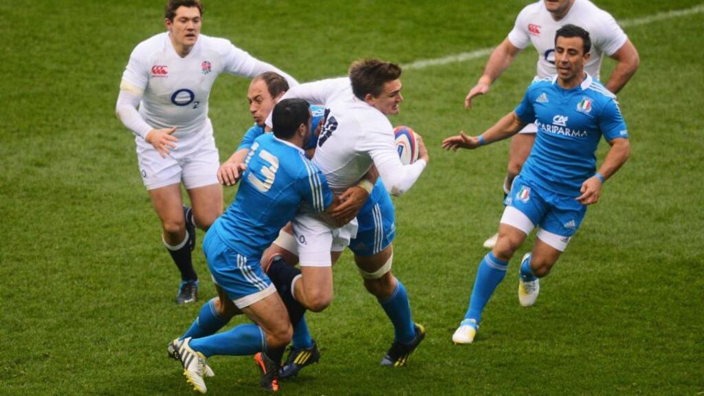 Toby Flood runs into Italy’s Gonzalo Canale and Sergio Parisse at Twickenham. Photograph: Mike Hewitt/Getty Images