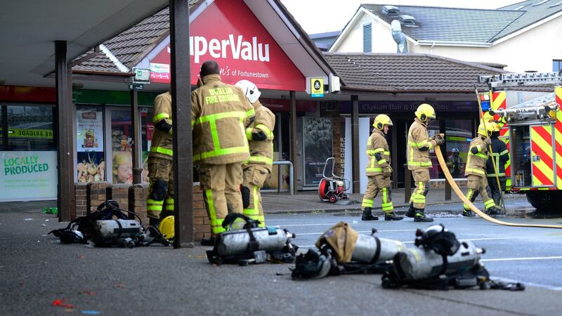 The scene at Fortunestown Shopping Centre in Tallaght on Thursday as fire fighters from Dublin Fire Briade controlled the fire. Photograph: Cyril Byrne/ The Irish Times