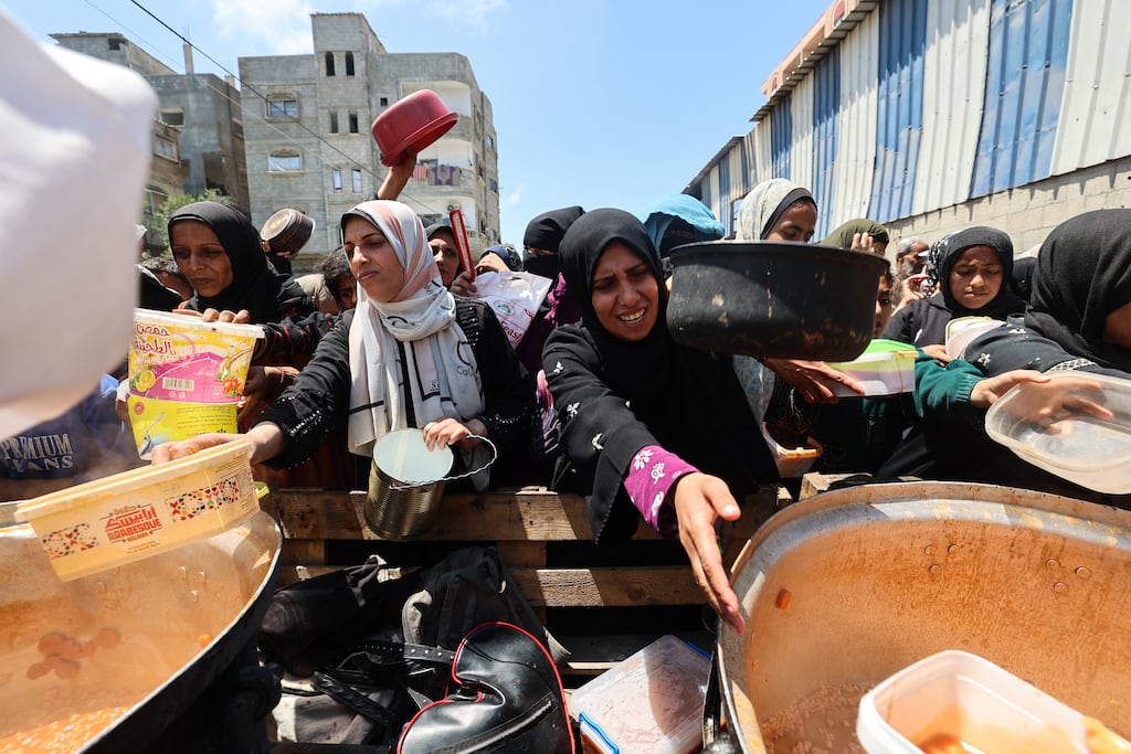 Palestinians queue for a portion of hot food distributed by a charity kitchen at the Nuseirat refugee camp in the central Gaza Strip on May 5th. Photograph: Eyad Baba/AFP via Getty Images