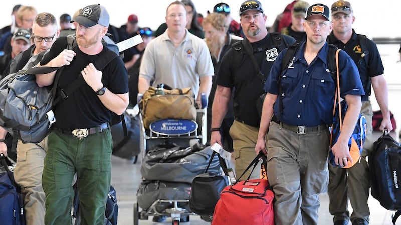 A contingent of 39 firefighters from north America arrive at Melbourne Airport to assist local fire crews. Photograph: Julian Smith/EPA.