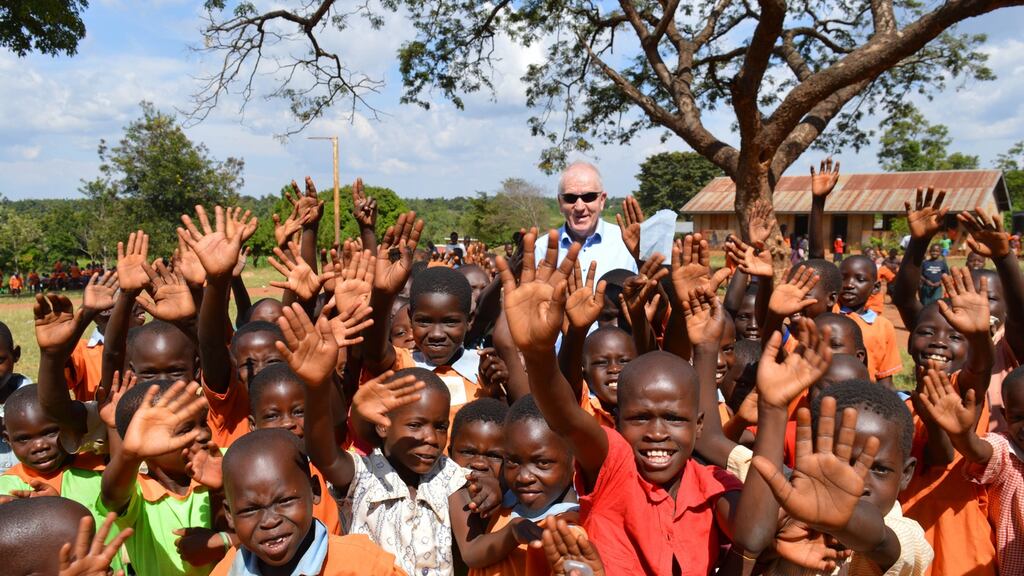 Former minister and Kerry footballer Jimmy Deenihan is pictured during a 2019 visit to Nyaminyagwe village in Bugiri District, Uganda. Irish charity Goal has helped to build a water borehole to provide the community with access to clean water.
