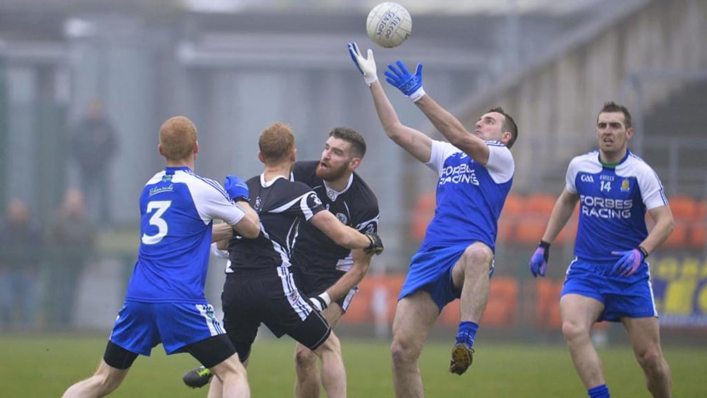 Kilcoo’s James Conway wins the ball ahead of Ballinderry’s Paul Greenan. Photograph: Russell Pritchard/Inpho/Presseye