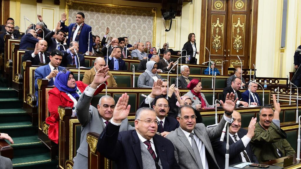 A group of Egyptian lawmakers raise their hands to vote during a parliament session to discuss and vote on proposed constitutional amendments in Cairo on Thursday. Photograph: Khaled Mashaal/EPA
