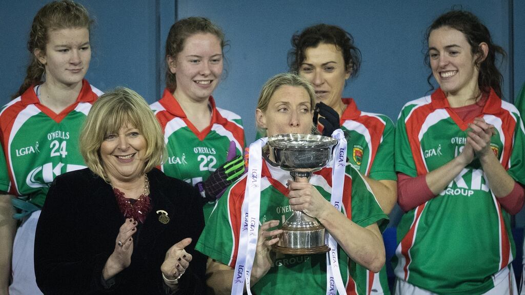 Carnacon’s Cora Staunton kisses the Delores Tyrell cup before lifting it. Photograph: Oisin Keniry/Inpho