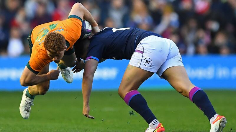 Andrew Kellaway is tackled by Sam Johnson. Photo: Andy Buchanan/AFP via Getty Images