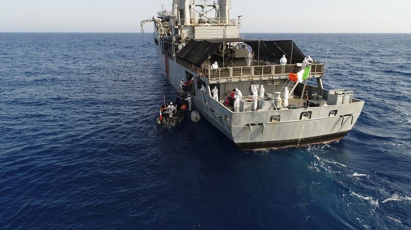LÉ Eithne rescues a total of 135 migrants from an inflatable craft about 83km northwest of Tripoli on Sunday. Photograph: Defence Forces