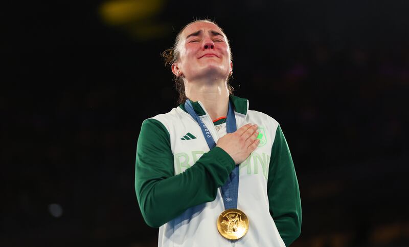 Kellie Harrington with her gold medal during the national anthem after winning the women's 60kg final at the Paris Olympics last year. Photograph: James Crombie/Inpho