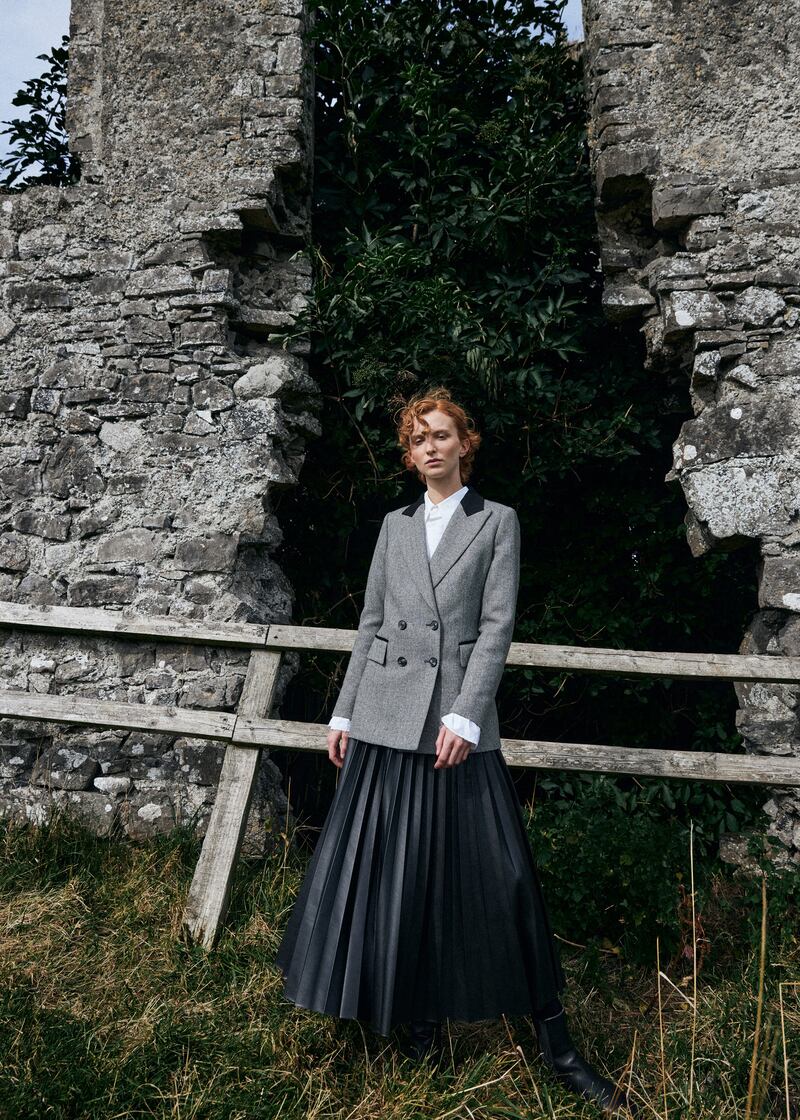 Black-and-white herringbone double-breasted blazer, €359, Triona; white shirt, €489, and black pleated skirt, €340, both MM6 at Beautiful South, Rathmines