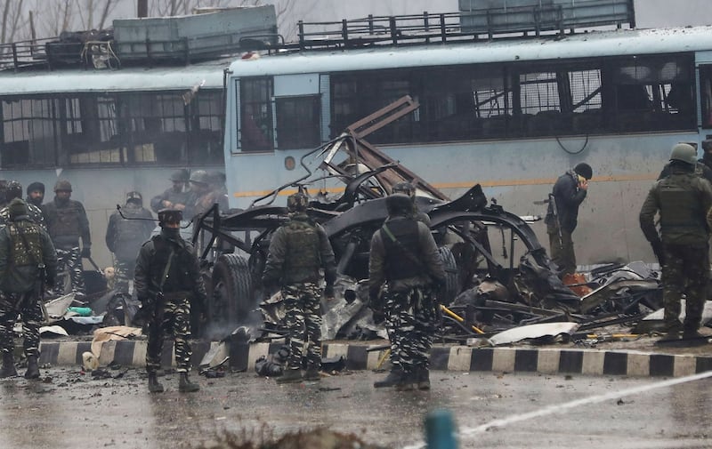 Indian security forces inspect remains of a vehicle following the car-bomb attack. Photograph: STR/AFP/Getty Images