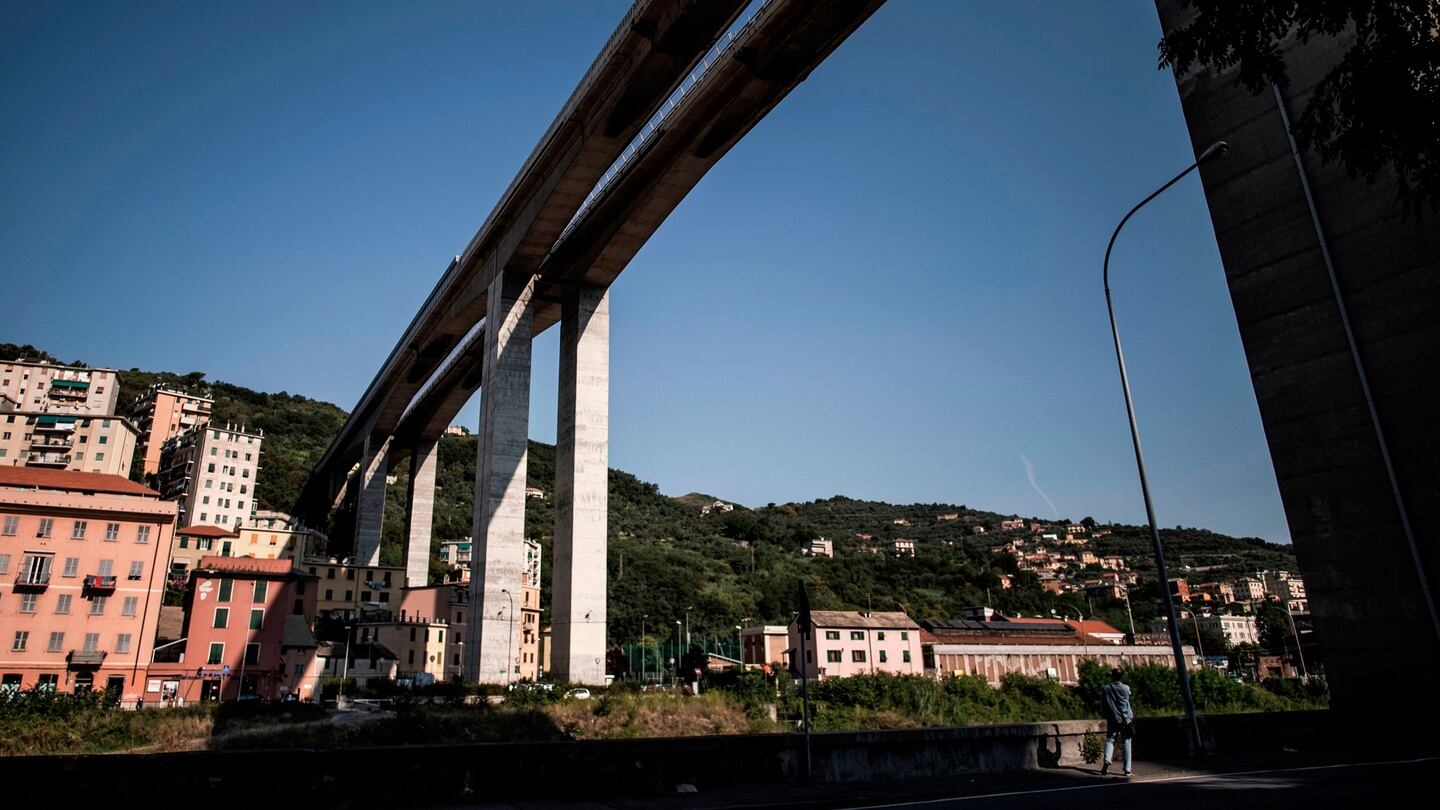 A man walks near the E80 highway bridge of Staglieno in Genoa. Photograph: Marcoi Bertorello/AFP/GEtty