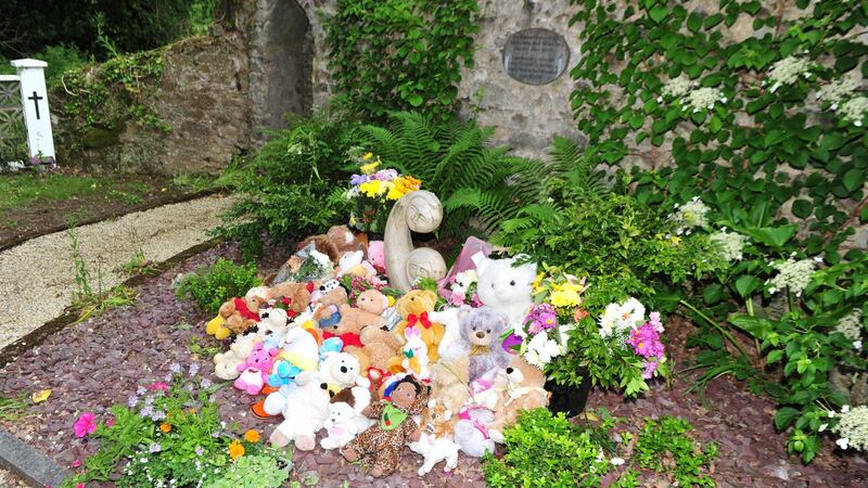 Teddy bears and toys, which had been fixed on the railings, after being  moved to the “Little Angels” plot in the graveyard at Bessborough House. Photograph: Michael Mac Sweeney/Provision