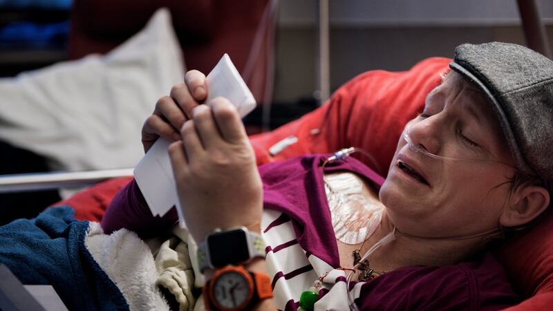 Marieke Vervoort, whose long-planned euthanasia was ultimately still more than a year away, weeps to read a farewell letter from a friend during a hospitalization in Diest, Belgium, January 2018. Photograph: Lynsey Addario/New York Times