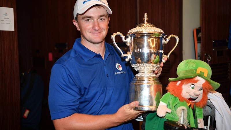 Ireland’s Paul Dunne celebrates with the trophy after Europe’s win in the EurAsia Cup. Photograph: Stuart Franklin/Getty Images