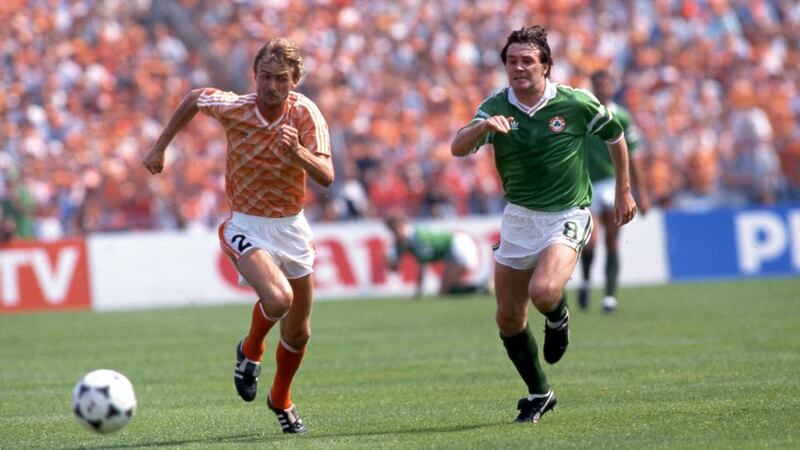 Euro 88: Adri van Tiggelen and Ray Houghton during Ireland’s Netherlands match. Photograph: Billy Stickland/Inpho