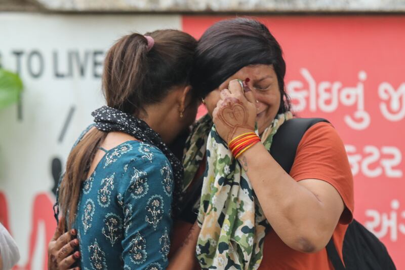 Air India crash: Relatives of a victim mourn after hearing the news of their death in Ahmedabad, western India. Photograph: EPA