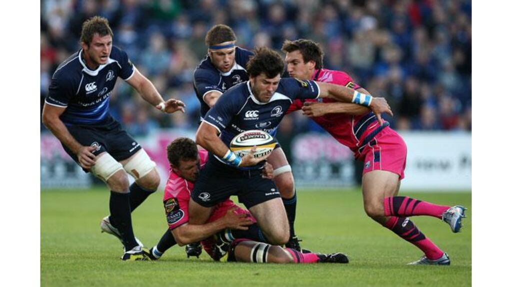 Leinster's Shane Horgan tackled by Deiniol Jones and Sam Warburton of Cardiff during their Magners League game at the RDS (Photograph: Dan Sheridan/Inpho)