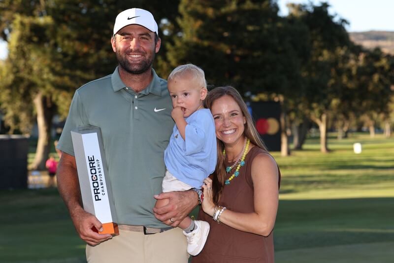 Scottie Scheffler with his son and wife Meredith after winning the Procore Championship. Photograph: Mike Mulholland/Getty Images