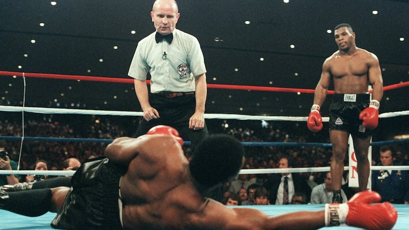 Mike Tyson defeats Trevor Berbick to become the youngest heavyweight champion in the world in November 1986 in Las Vegas. Photograph: AFP/Getty Images