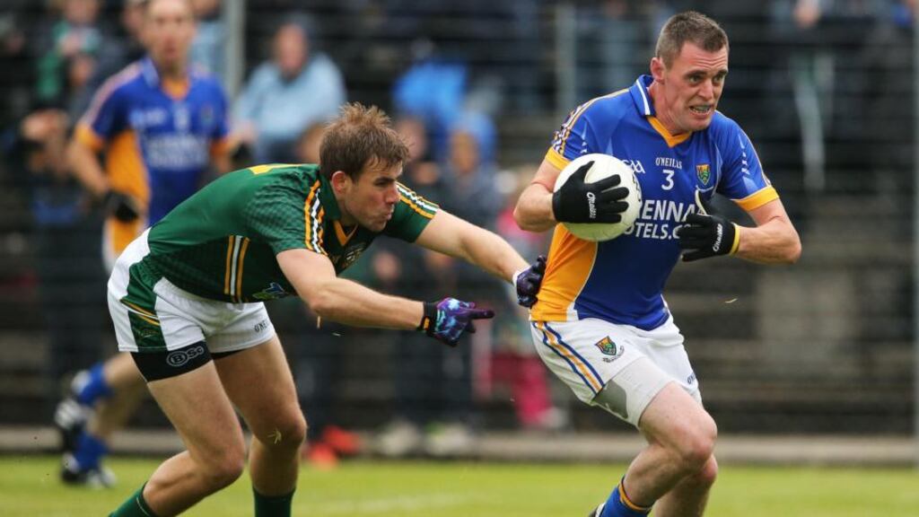 Wicklow’s Damian Power is tracked by Brian Farrell of Meath in Aughrim. Photograph: Cathal Noonan/Inpho