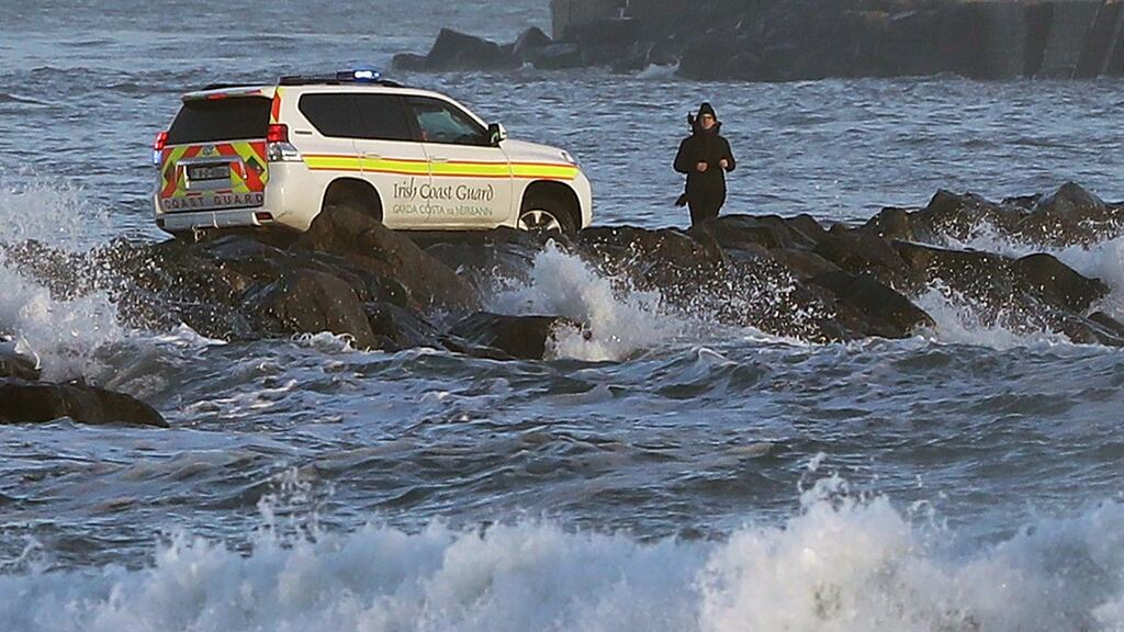 The Coast Guard came  to the assistance of a walker during high winds and swells on Dublin’s great south wall as the tail end of Storm Diana crossed the East Coast   on  November 27th. Photograph: Niall Carson/PA
