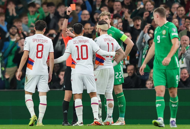 Armenia’s Tigran Barseghyan is shown a red card. Photograph: Ryan Byrne/Inpho